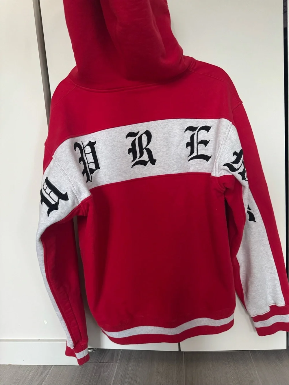 Supreme Red and White Zip-Up Hoodie with Gothic Script
